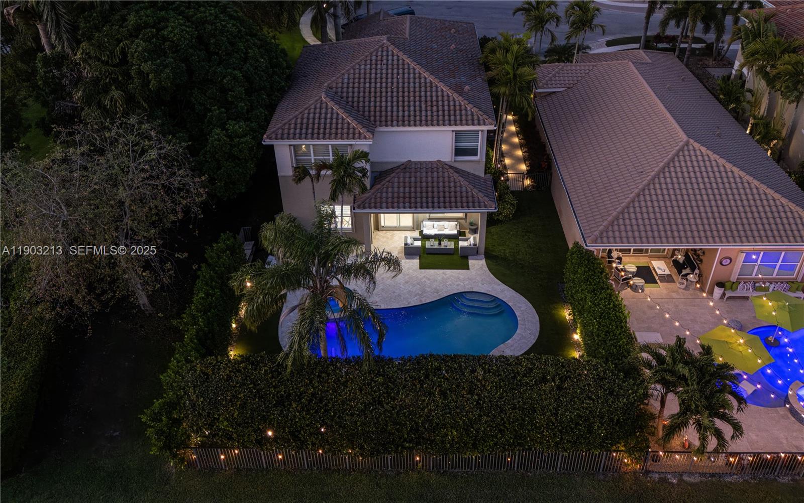 8292 Triana Point Avenue Boynton Beach, FL 33473 - Photo 5 of 60 a view of a house with a yard and garden