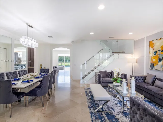a living room with furniture and white walls