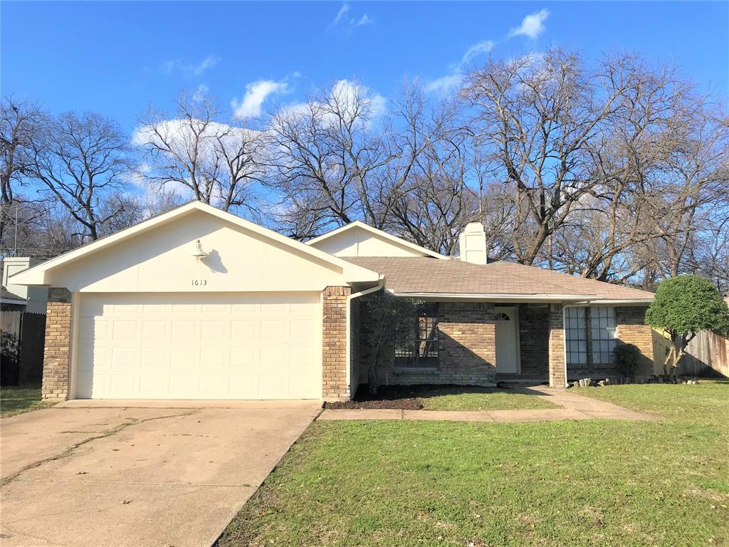 1613 Jasmine Lane Plano, TX 75074 - Photo 1 of 1 a front view of a house with a yard and garage