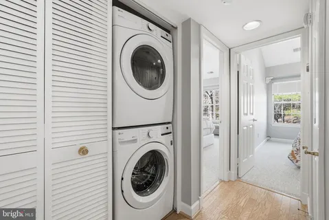 a view of a hallway with washer and dryer