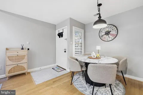 a view of a room that has a table and chair