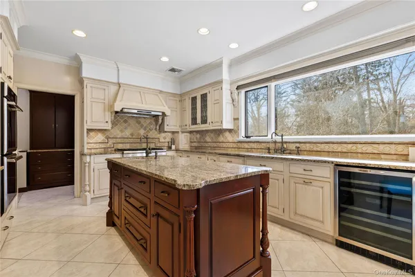 a kitchen with stainless steel appliances granite countertop a stove and a sink