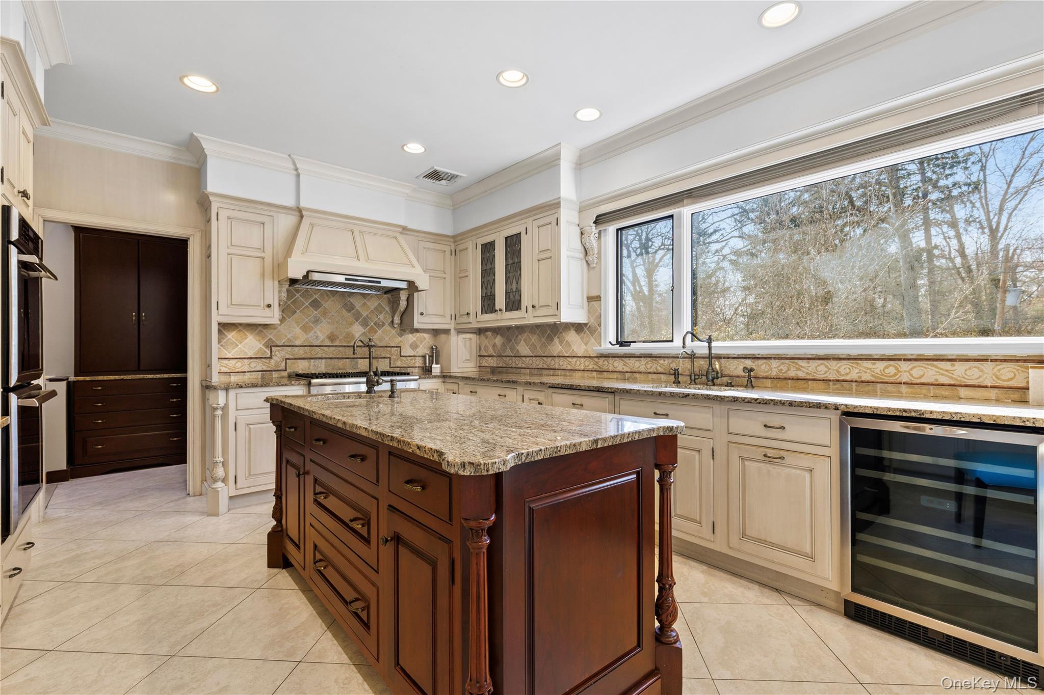 112 Woodlands Road Harrison, NY 10528 - Photo 12 of 43 a kitchen with stainless steel appliances granite countertop a stove and a sink