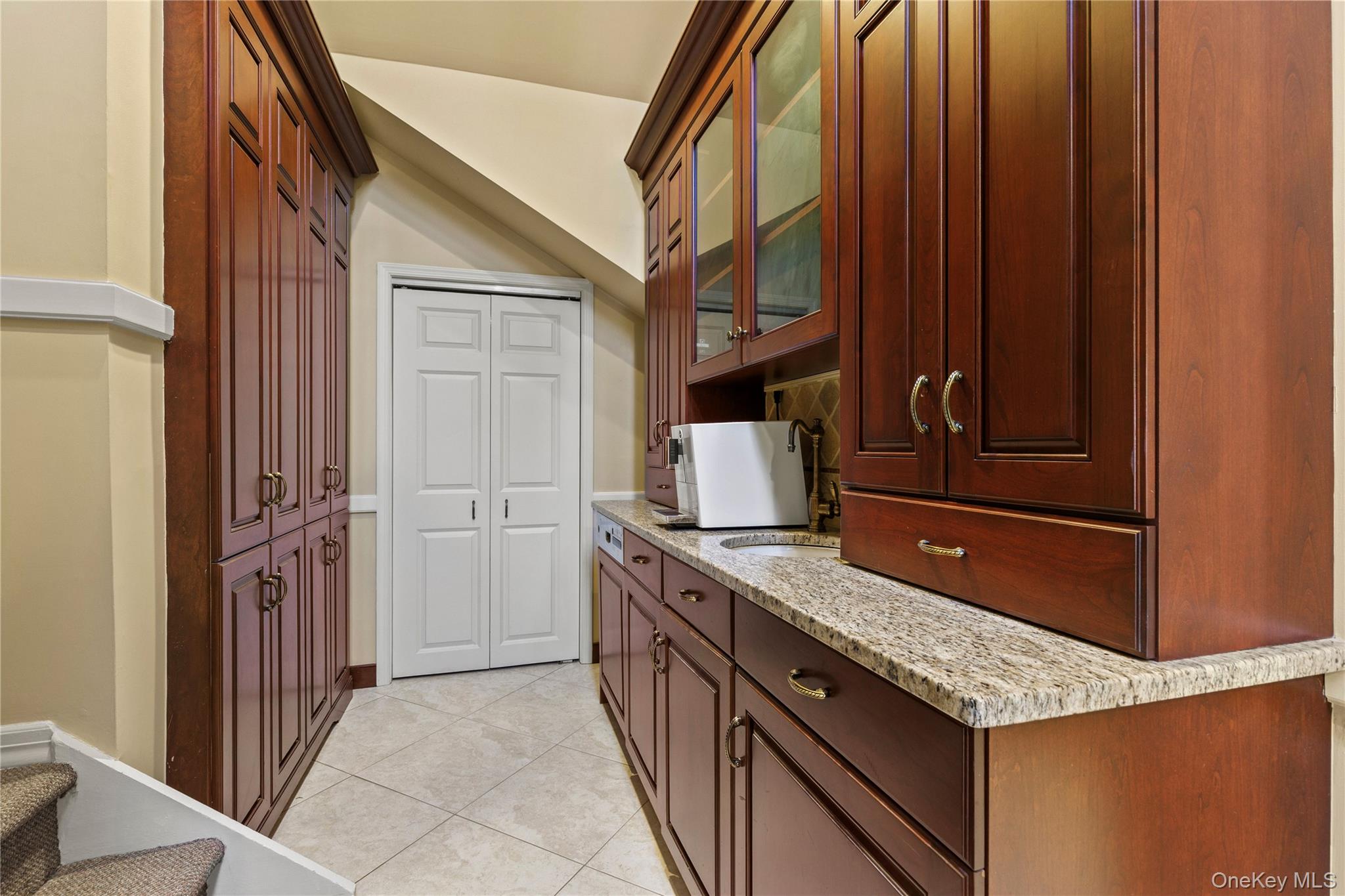 112 Woodlands Road Harrison, NY 10528 - Photo 14 of 43 a kitchen with a stove and a refrigerator