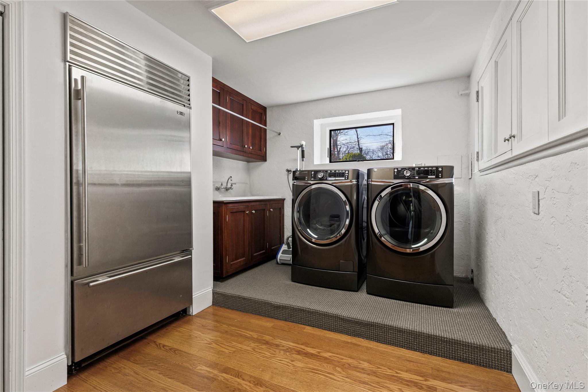 112 Woodlands Road Harrison, NY 10528 - Photo 21 of 43 a view of a kitchen with washer and dryer