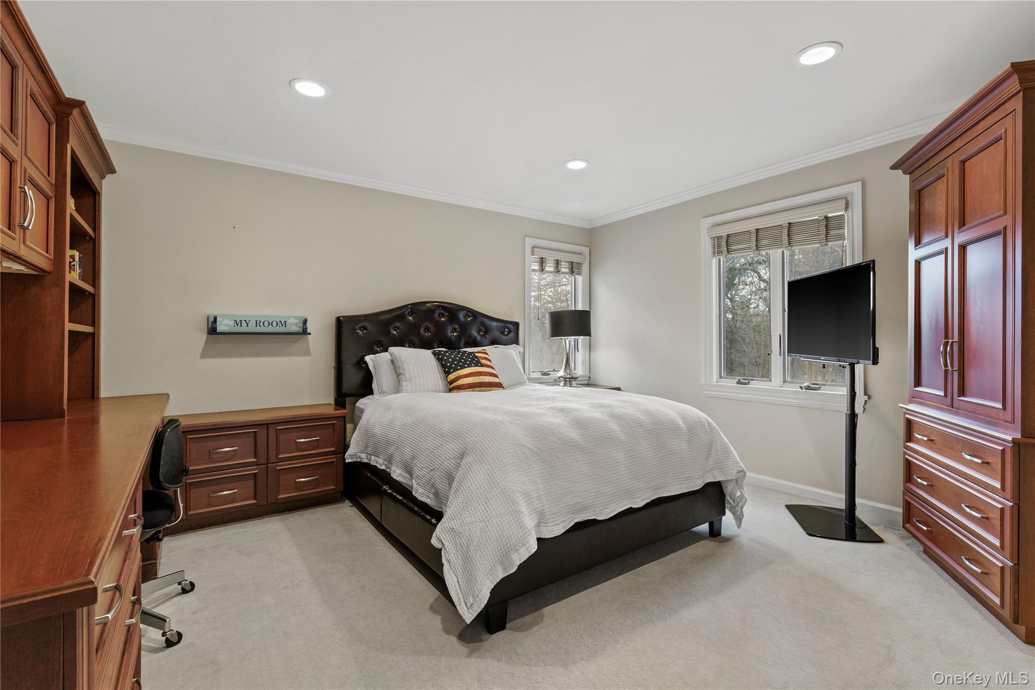 112 Woodlands Road Harrison, NY 10528 - Photo 26 of 43 a bedroom with a bed and a television