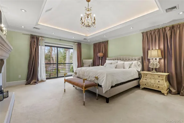 a spacious bedroom with a bed and large window
