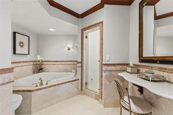 a bathroom with a tub and a sink