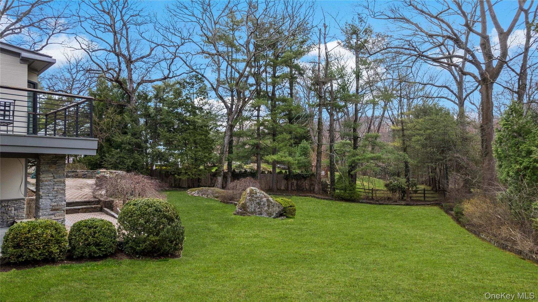 112 Woodlands Road Harrison, NY 10528 - Photo 33 of 43 a front view of a house with a yard
