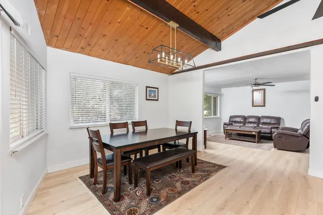a livingroom with furniture wooden floor and a window