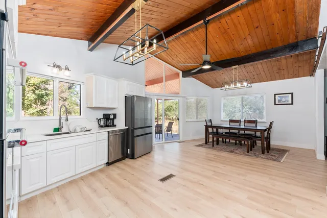 a kitchen with lots of counter top space and dining table