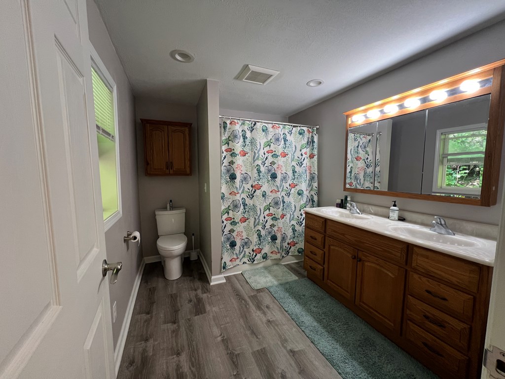 155 Cherry Run Road Rouseville, PA 16344 - Photo 12 of 19 a spacious bathroom with a double vanity sink toilet and shower