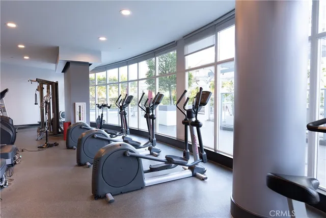 a living room with fireplace furniture and a wooden floor