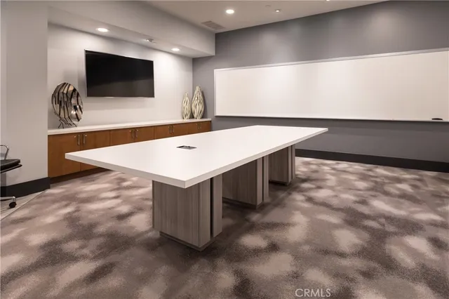 a kitchen with stainless steel appliances granite countertop a stove and a refrigerator