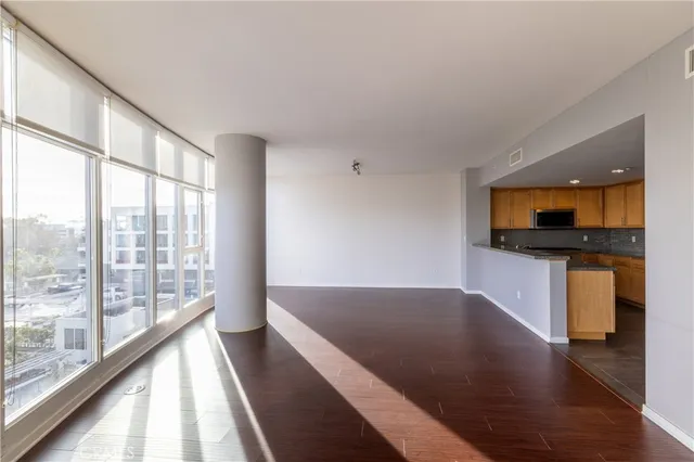 a view of a living room with hardwood floor