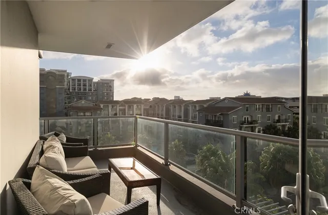 a view of a balcony with furniture