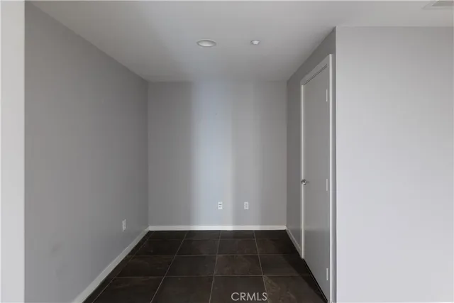 a bathroom with a shower and a glass door