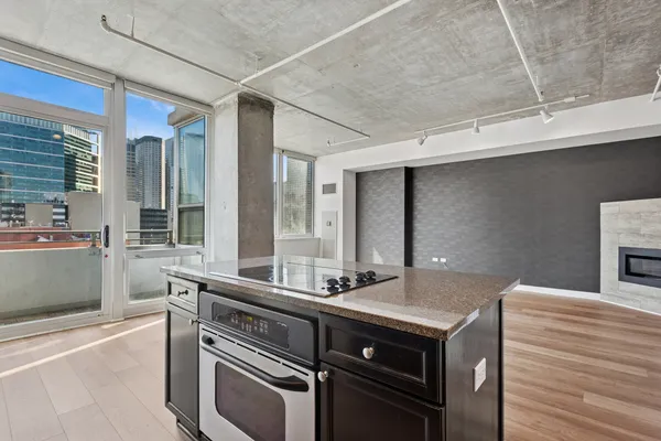 a kitchen with a sink and a refrigerator