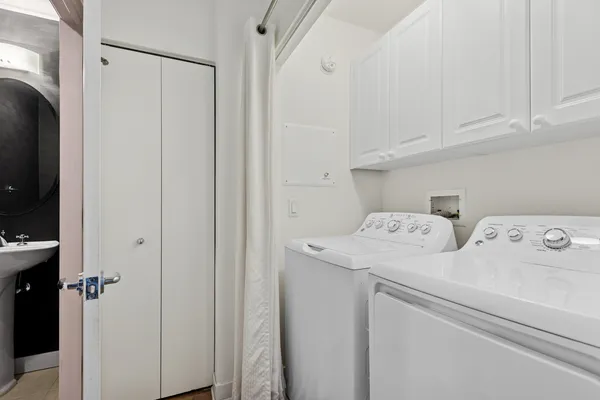 a view of storage and utility room with washer and dryer
