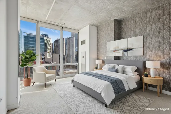 a bedroom with a bed and a couch