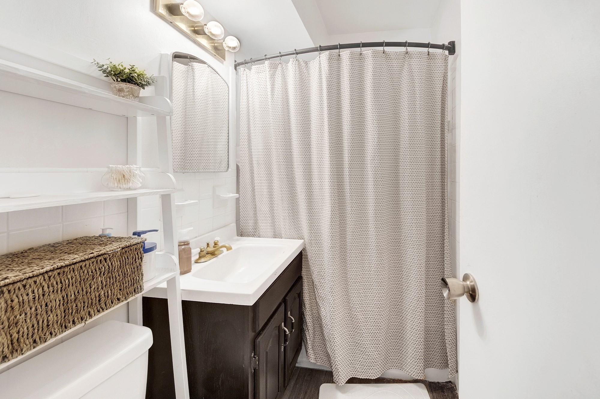 3130 Irwin Avenue, Unit 2C Bronx, NY 10463 - Photo 20 of 30 Bathroom featuring backsplash, toilet, vanity, and a shower with shower curtain
