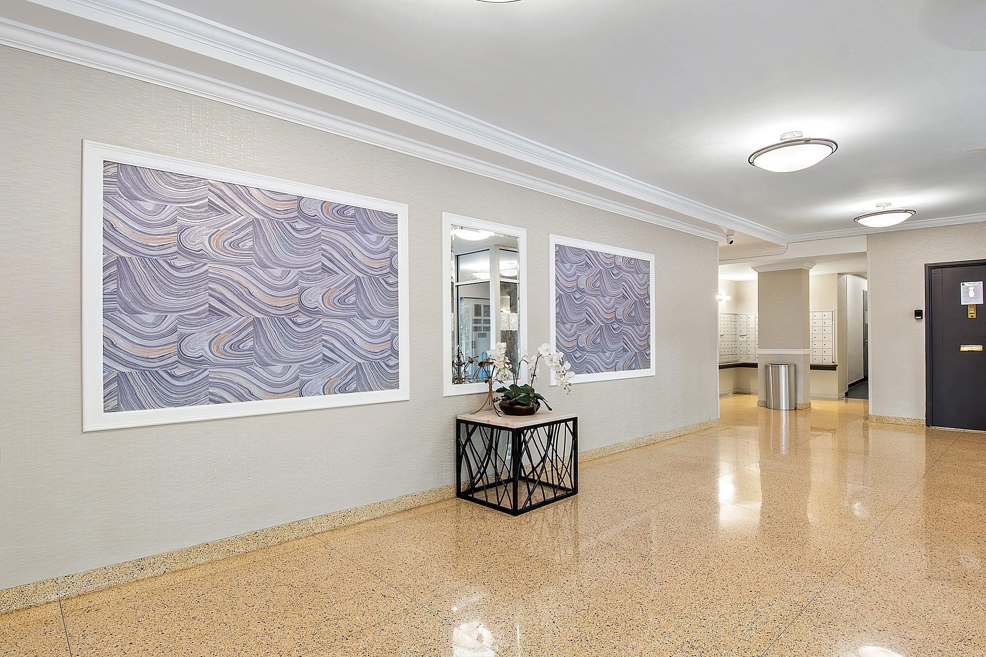 3130 Irwin Avenue, Unit 2C Bronx, NY 10463 - Photo 22 of 30 Corridor with speckled floor, crown molding, and baseboards