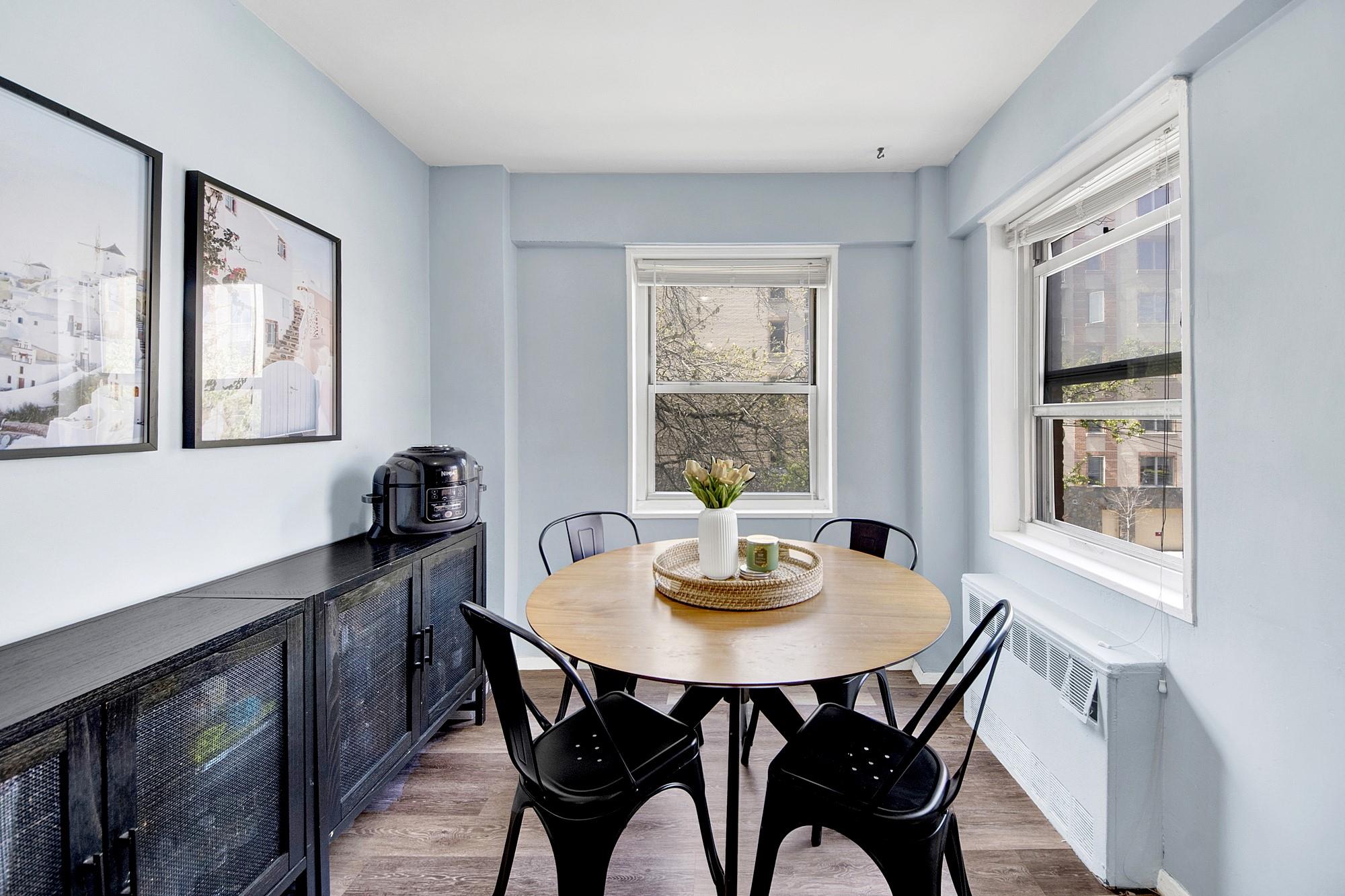 3130 Irwin Avenue, Unit 2C Bronx, NY 10463 - Photo 5 of 30 Dining space featuring light wood-style LVP floors and radiator heating unit