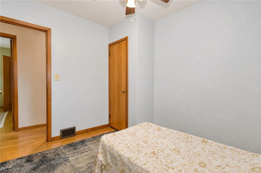 3864 State Road South Ashtabula, OH 44004 - Photo 25 of 50 Hardwood flooring, light-toned wall finishes, solid panel door, wood trim