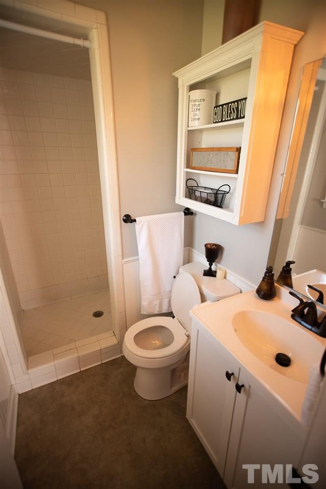3029 Peebles Road Raleigh, NC 27616 - Photo 12 of 28 a bathroom with a sink and a mirror