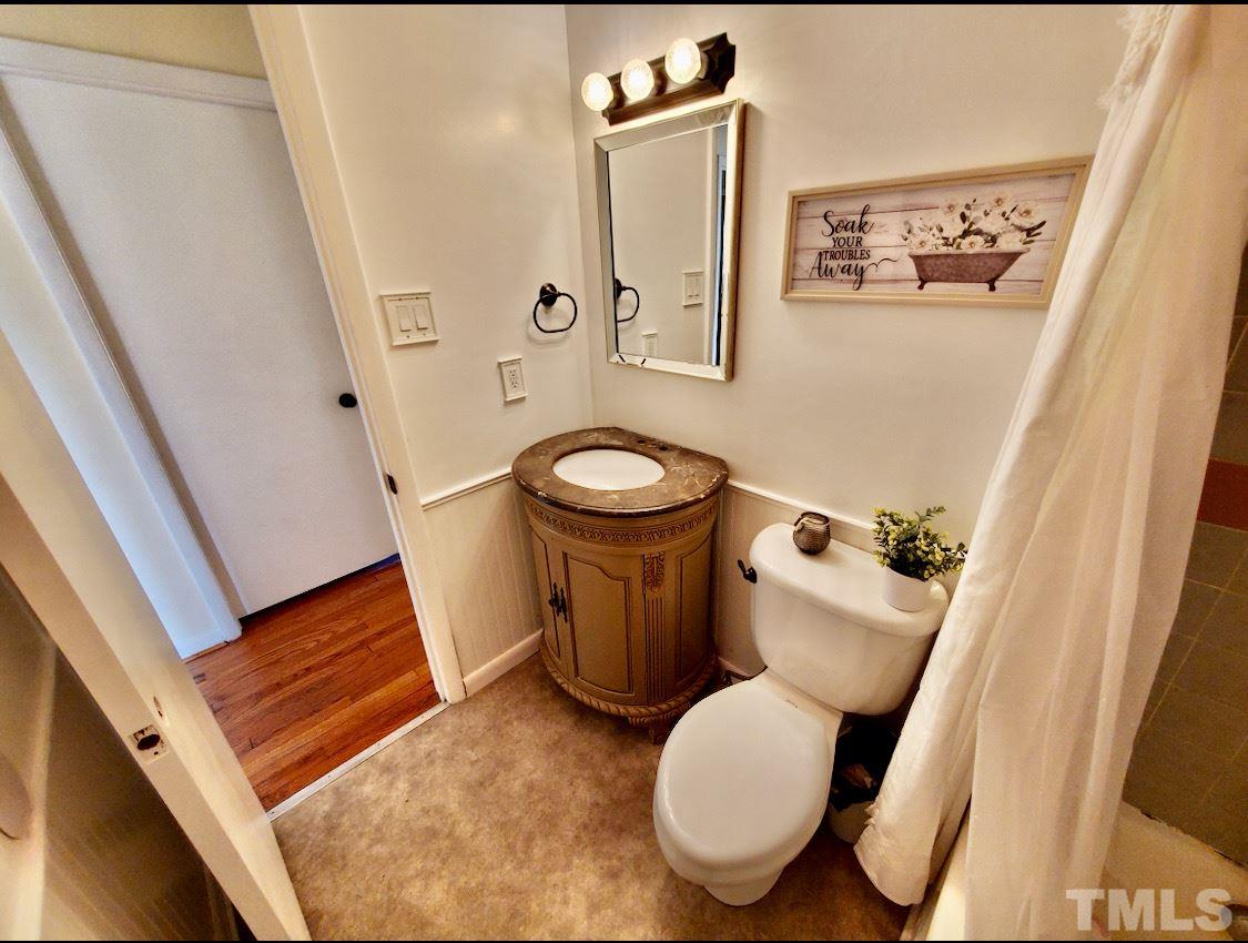3029 Peebles Road Raleigh, NC 27616 - Photo 14 of 28 a white toilet sitting next to a small bathroom