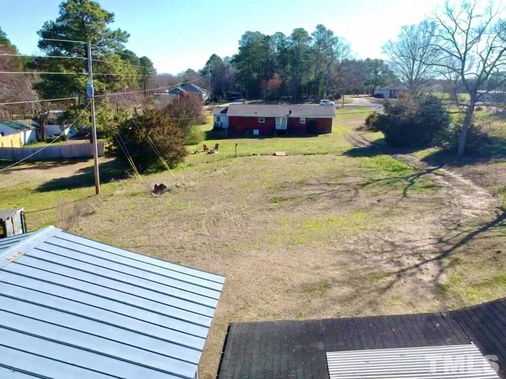 3029 Peebles Road Raleigh, NC 27616 - Photo 26 of 28 a view of a terrace with a bench