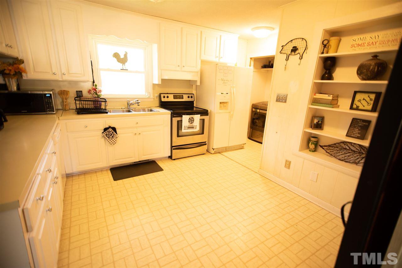 3029 Peebles Road Raleigh, NC 27616 - Photo 4 of 28 a view of a kitchen with appliances and cabinets