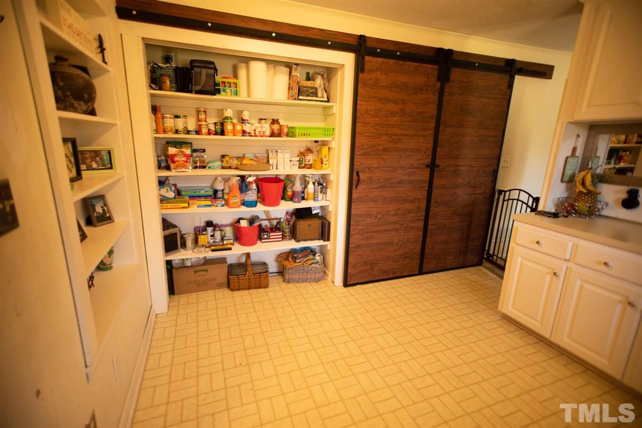 3029 Peebles Road Raleigh, NC 27616 - Photo 5 of 28 a view of walk in closet with clothes and shoes