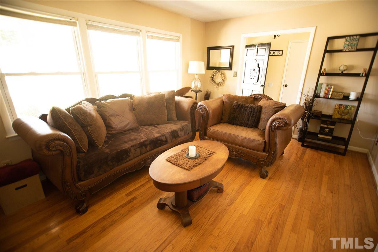 3029 Peebles Road Raleigh, NC 27616 - Photo 8 of 28 a living room with furniture a table and a window