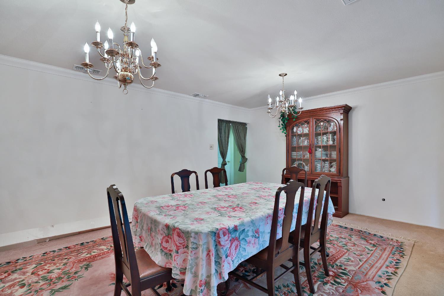 3840 Greenstone Road Placerville, CA 95667 - Photo 11 of 49 a view of a dining room with furniture and chandelier