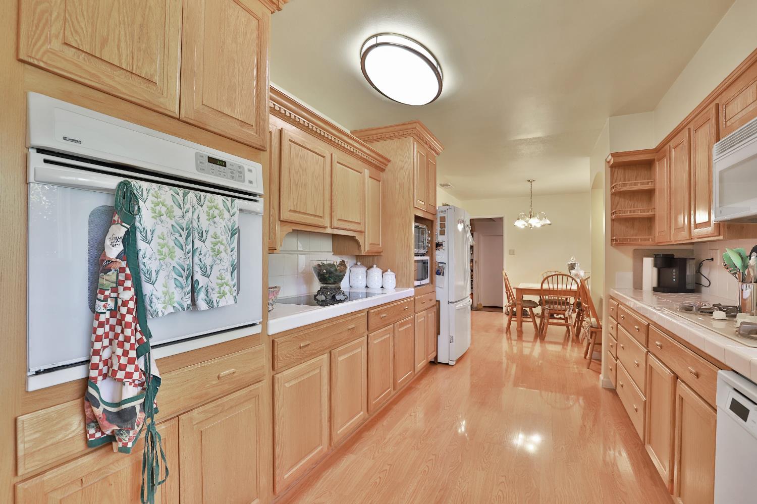 3840 Greenstone Road Placerville, CA 95667 - Photo 16 of 49 a kitchen with furniture a large window and chairs