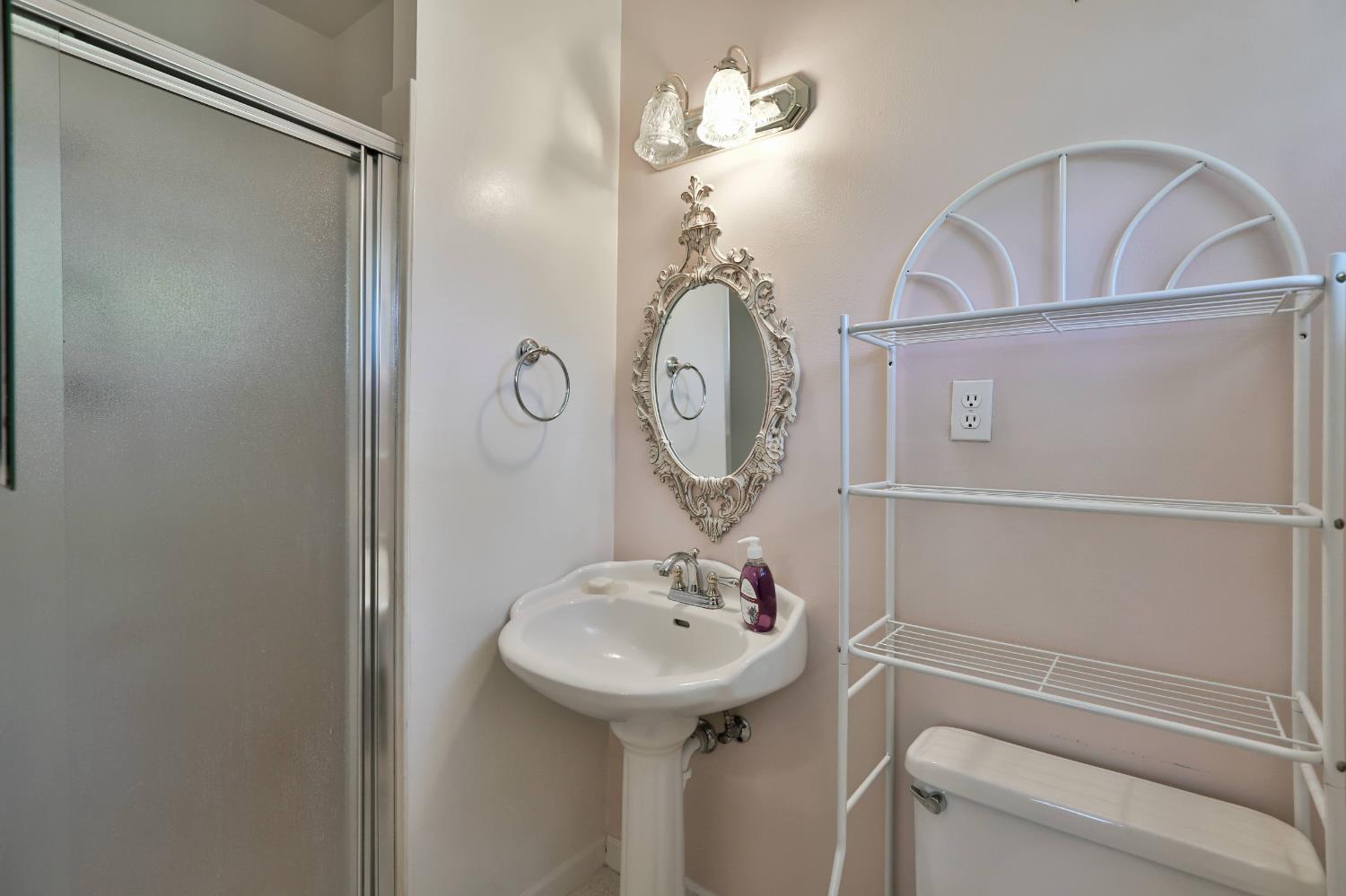 3840 Greenstone Road Placerville, CA 95667 - Photo 18 of 49 a bathroom with a sink a mirror and a window