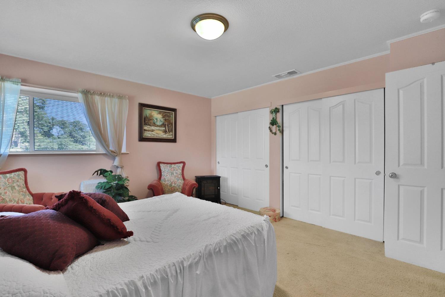 3840 Greenstone Road Placerville, CA 95667 - Photo 20 of 49 a bedroom with a bed and a painting on the wall