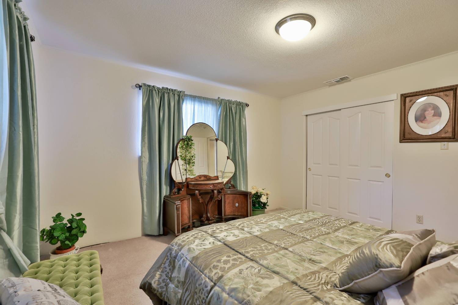 3840 Greenstone Road Placerville, CA 95667 - Photo 23 of 49 a bedroom with a bed and a mirror