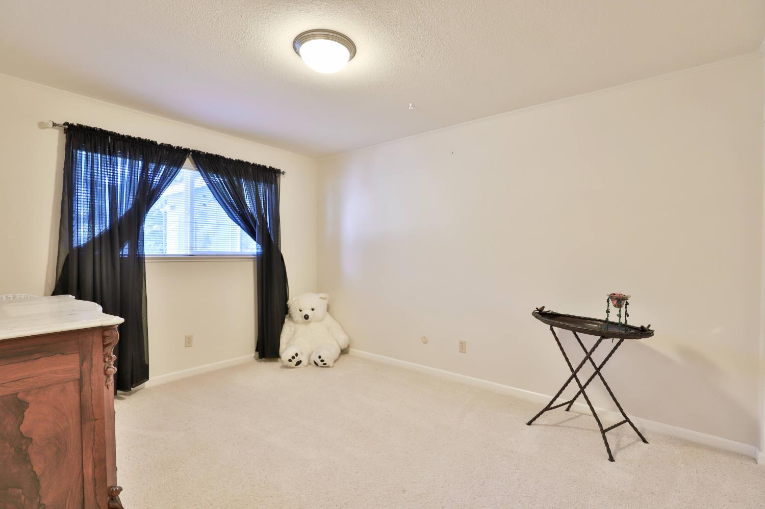 3840 Greenstone Road Placerville, CA 95667 - Photo 25 of 49 a view of a livingroom with wooden floor and a ceiling fan