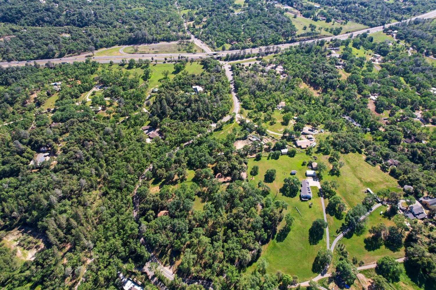 3840 Greenstone Road Placerville, CA 95667 - Photo 48 of 49 a view of a lush green forest with lots of trees