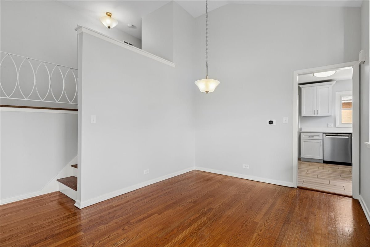 8846 North Ozanam Avenue Niles, IL 60714 - Photo 12 of 24 a view of a kitchen with wooden floor and a sink
