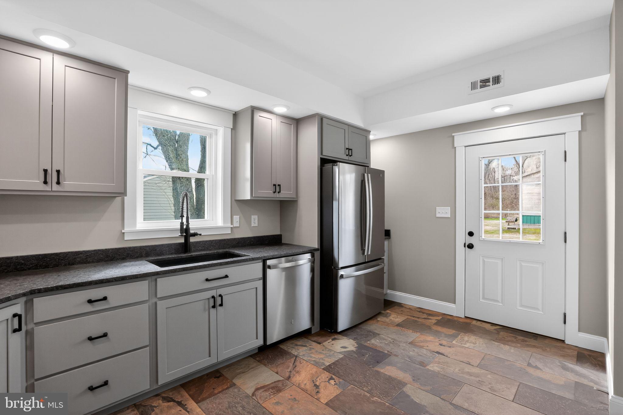128 Maugers Mill Road Pottstown, PA 19464 - Photo 15 of 42 Modern kitchen with sleek finishes.