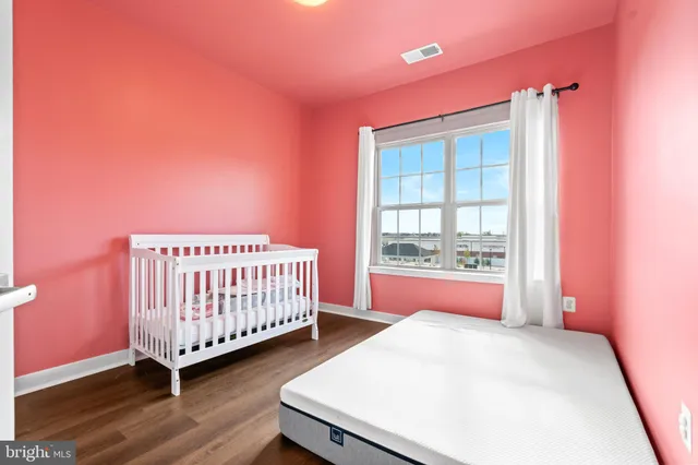 a bed room with a bed and a window