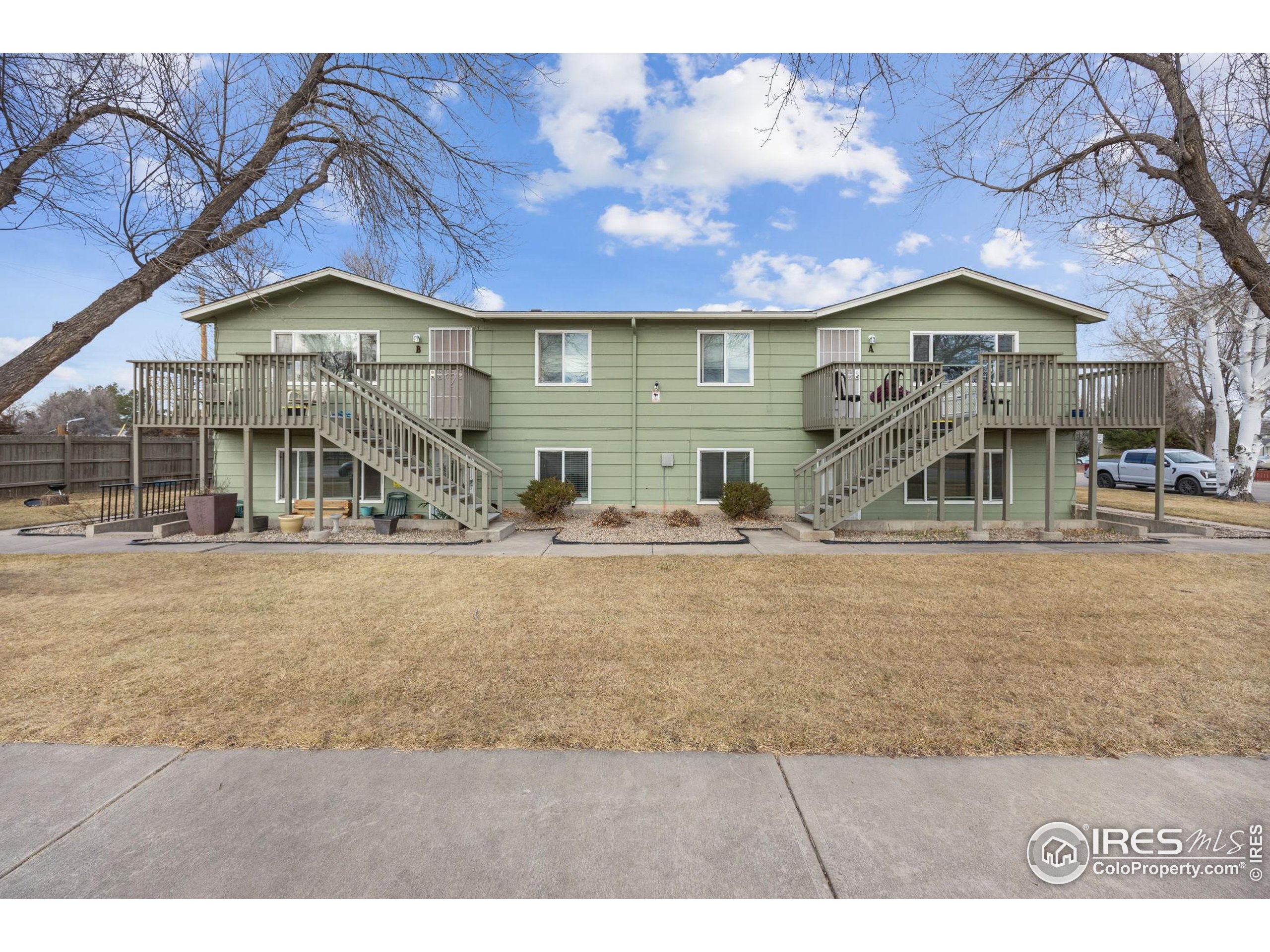 701 Aztec Drive Fort Collins, CO 80521 - Photo 1 of 43 a front view of house with a yard