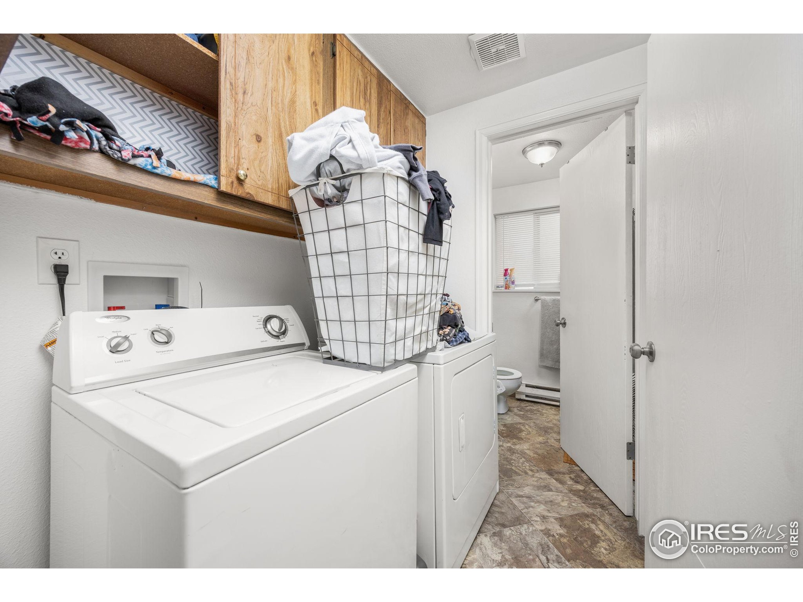 701 Aztec Drive Fort Collins, CO 80521 - Photo 12 of 43 a utility room with dryer and washer