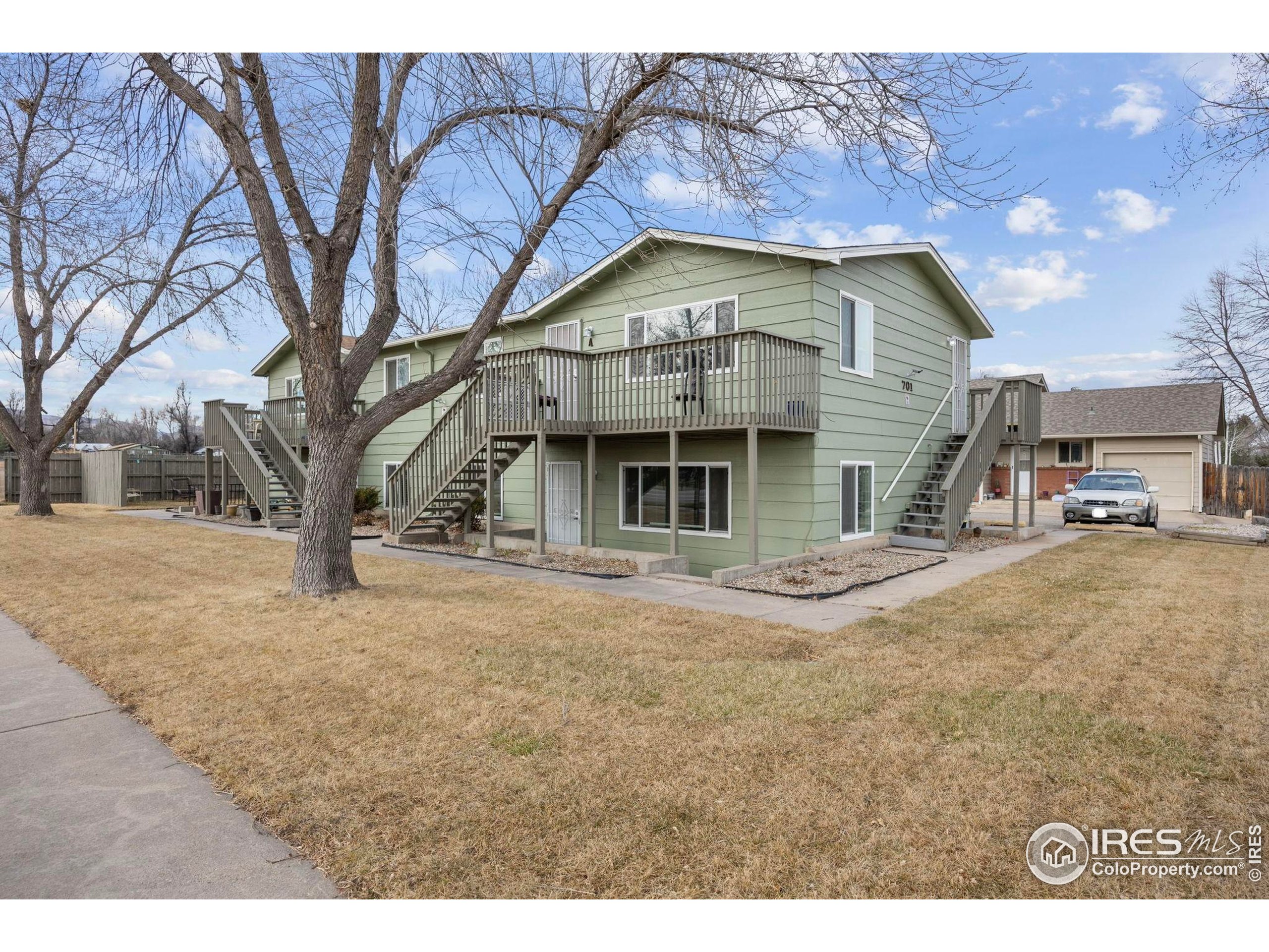 701 Aztec Drive Fort Collins, CO 80521 - Photo 2 of 43 a view of a house with a large tree