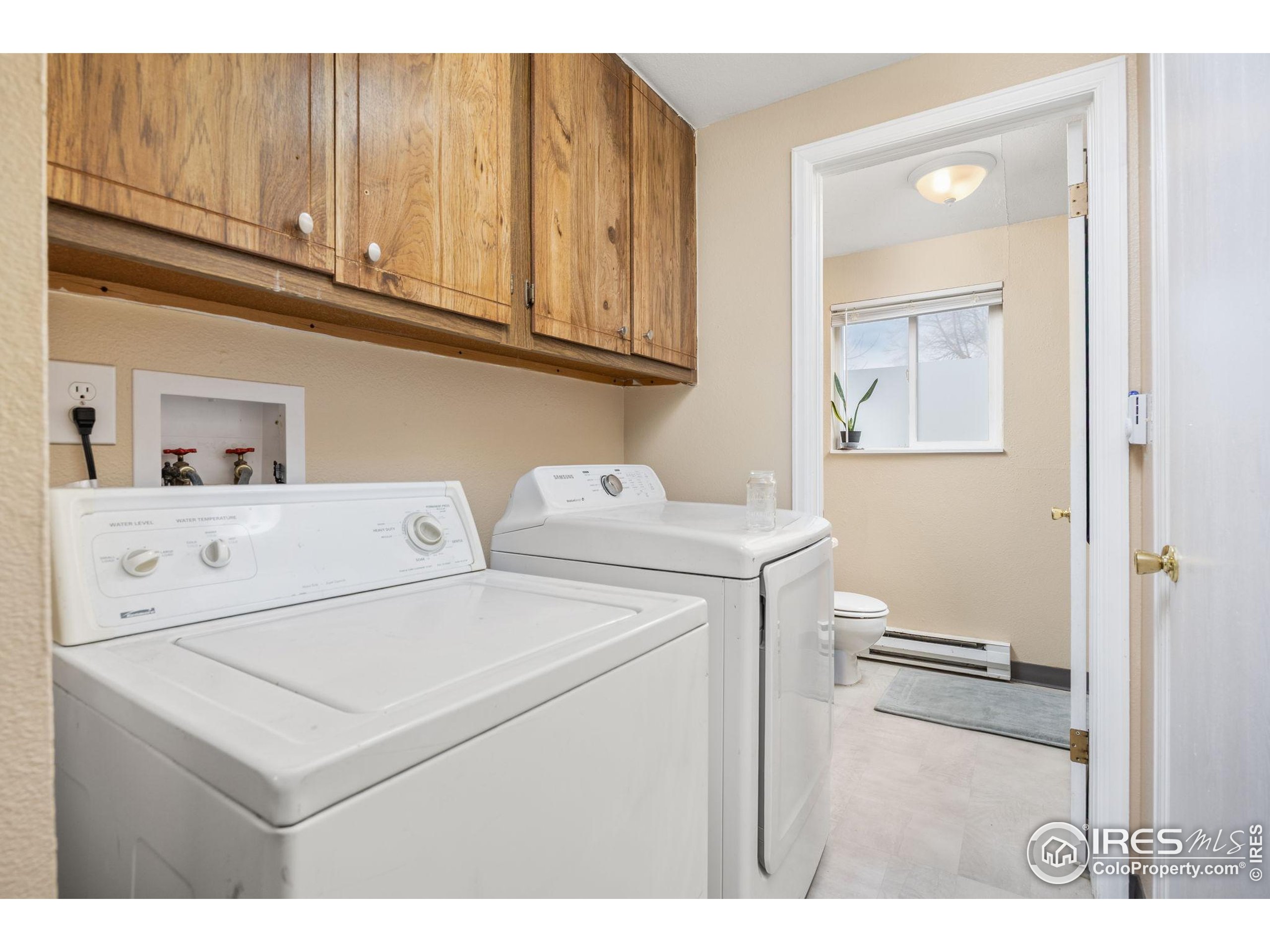 701 Aztec Drive Fort Collins, CO 80521 - Photo 23 of 43 a utility room with dryer and washer