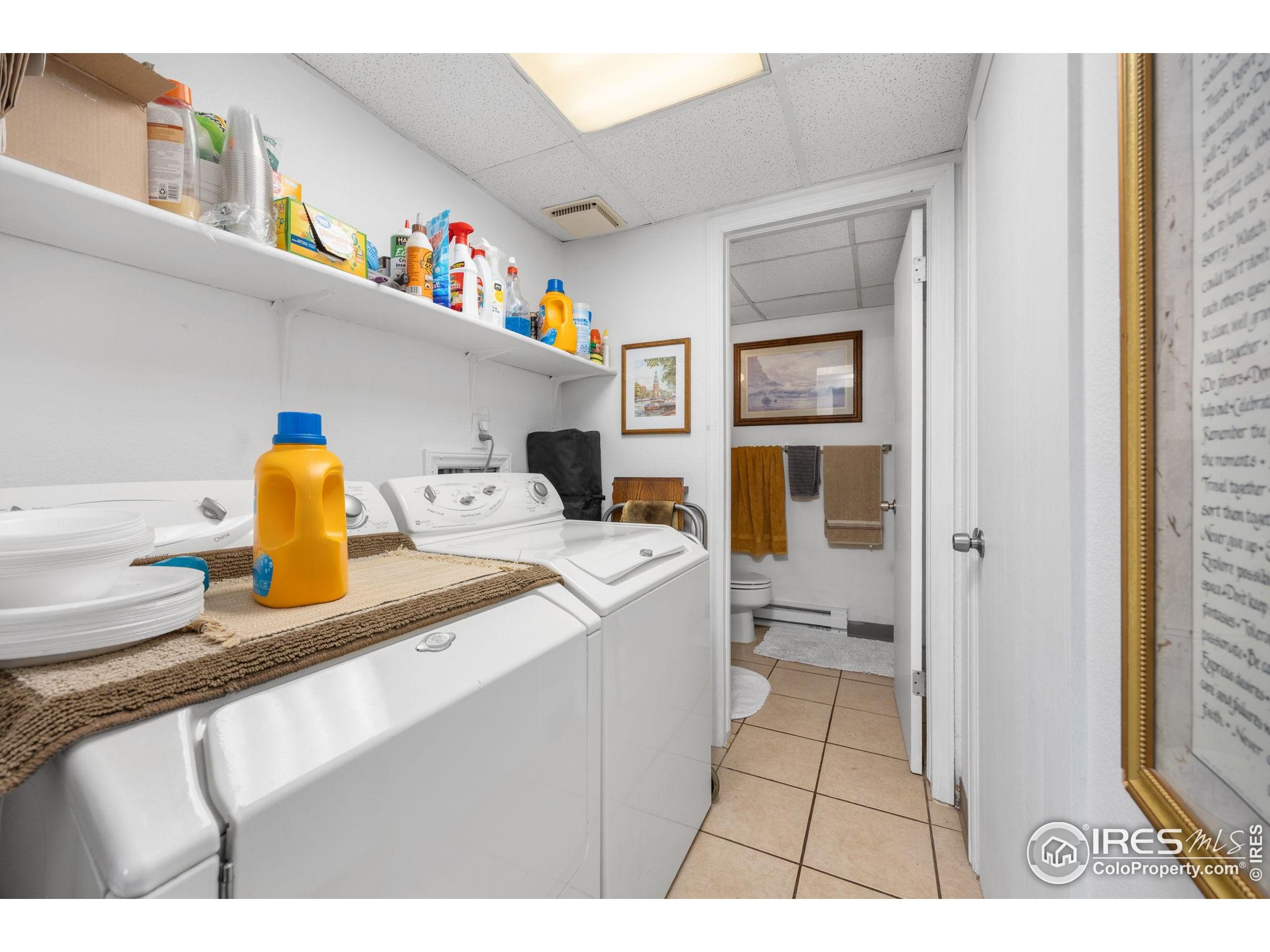 701 Aztec Drive Fort Collins, CO 80521 - Photo 40 of 43 a utility room with a sink dryer and washer