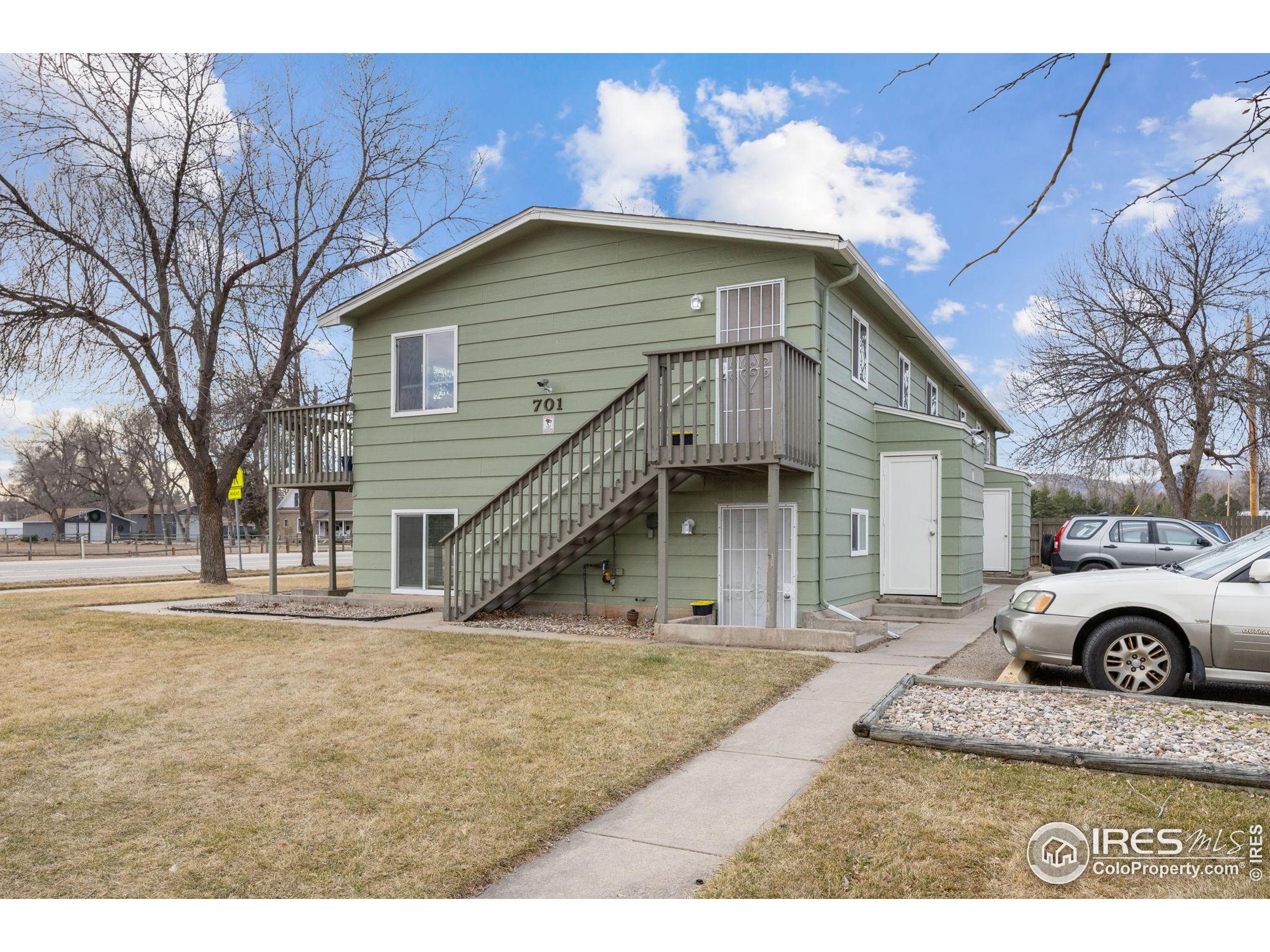 701 Aztec Drive Fort Collins, CO 80521 - Photo 42 of 43 a view of a house with a yard